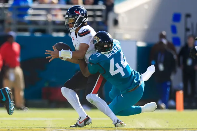 Jacksonville Jaguars defensive end Travon Walker (44) sacks Houston Texans quarterback C.J. Stroud (7) during the first quarter of an NFL football matchup Sunday, Dec. 1, 2024 at EverBank Stadium in Jacksonville, Fla. [Corey Perrine/Florida Times-Union]