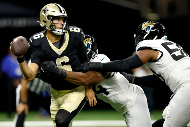 NEW ORLEANS, LOUISIANA - AUGUST 17: Tyler Shough #6 of the New Orleans Saints is sacked by Travon Walker #44 of the Jacksonville Jaguars during the first quarter of the NFL Preseason 2025 at Caesars Superdome on August 17, 2025 in New Orleans, Louisiana. (Photo by Sean Gardner/Getty Images)