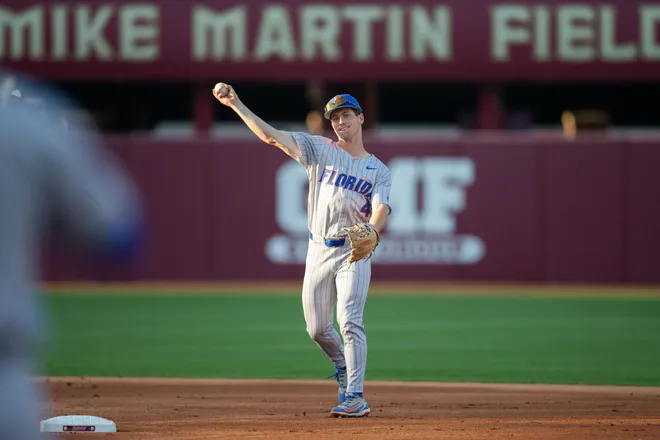 Florida Gators infielder Cade Kurland (4) throws to first. throws to first. The Florida State Seminoles hosted the Florida Gators at Dick Howser Stadium on Tuesday, April 7, 2026.