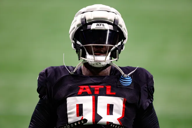 ATLANTA, GEORGIA - AUGUST 2: Ruke Orhorhoro #98 of the Atlanta Falcons warms up during NFL training camp at Mercedes-Benz Stadium on August 2, 2024 in Atlanta, Georgia. (Photo by Todd Kirkland/Getty Images)