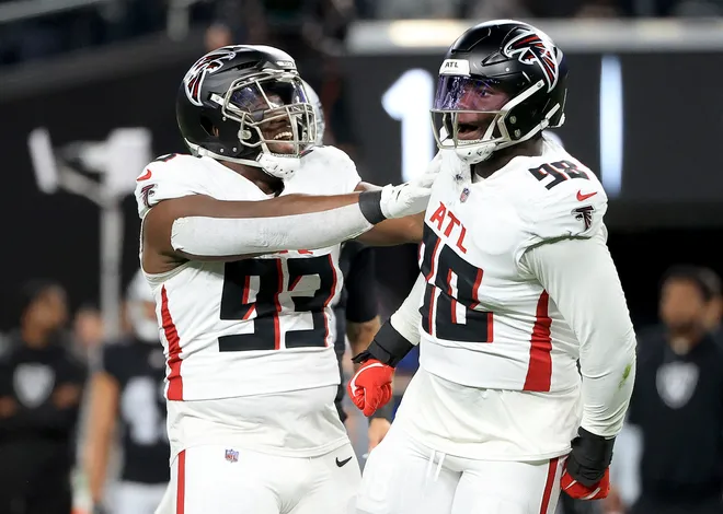 LAS VEGAS, NEVADA - DECEMBER 16: Ruke Orhorhoro #98 and Kentavius Street #93 of the Atlanta Falcons celebrate a tackle against the Las Vegas Raiders during the first quarter in the game at Allegiant Stadium on December 16, 2024 in Las Vegas, Nevada. (Photo by Ian Maule/Getty Images)