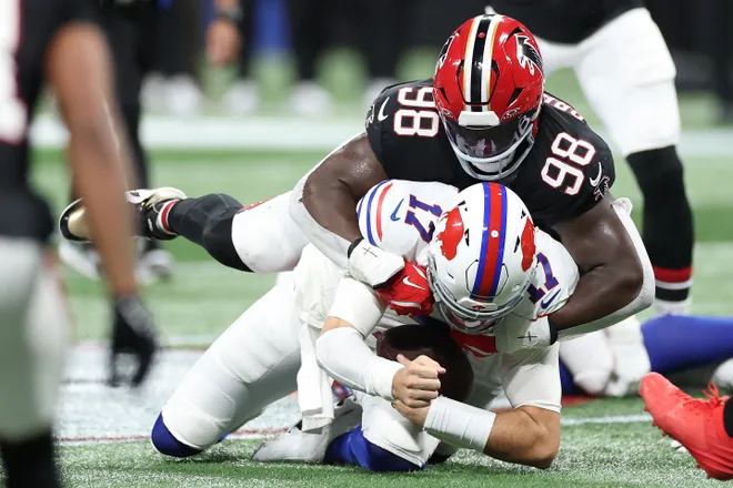 ATLANTA, GEORGIA - OCTOBER 13: Josh Allen #17 of the Buffalo Bills is tackled by Ruke Orhorhoro #98 of the Atlanta Falcons in the second quarter of the game at Mercedes-Benz Stadium on October 13, 2025 in Atlanta, Georgia. (Photo by Kevin C. Cox/Getty Images)