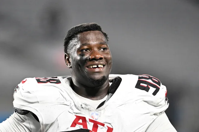 Oct 13, 2024; Charlotte, North Carolina, USA; Atlanta Falcons defensive tackle Ruke Orhorhoro (98) walks off the field after the game at Bank of America Stadium. Mandatory Credit: Bob Donnan-Imagn Images