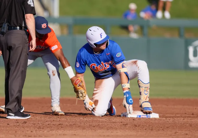 Florida infielder Ethan Surowiec (10) beats the throw to Auburn infielder Chris Rembert (2) at second durning and NCAA baseball game at Condron Family Ballparkin Gainesville, FL on Friday, April 17, 2026. [Alan Youngblood/Gainesville Sun]