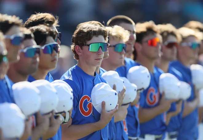Florida listen to the national anthem before an NCAA baseball game at Condron Family Ballpark in Gainesville, FL on Friday, April 17, 2026. [Alan Youngblood/Gainesville Sun]