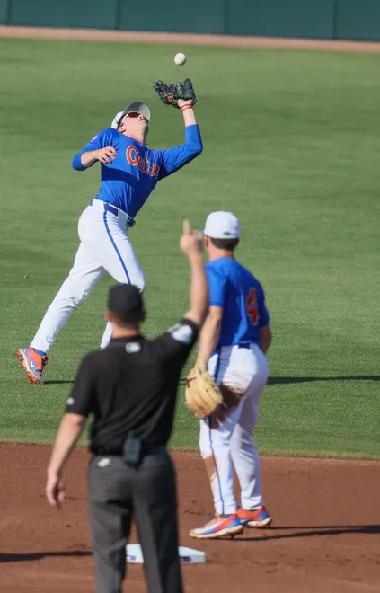 Florida infielder Brendan Lawson (11) grabs the fly durning and NCAA baseball game at Condron Family Ballparkin Gainesville, FL on Friday, April 17, 2026. [Alan Youngblood/Gainesville Sun]