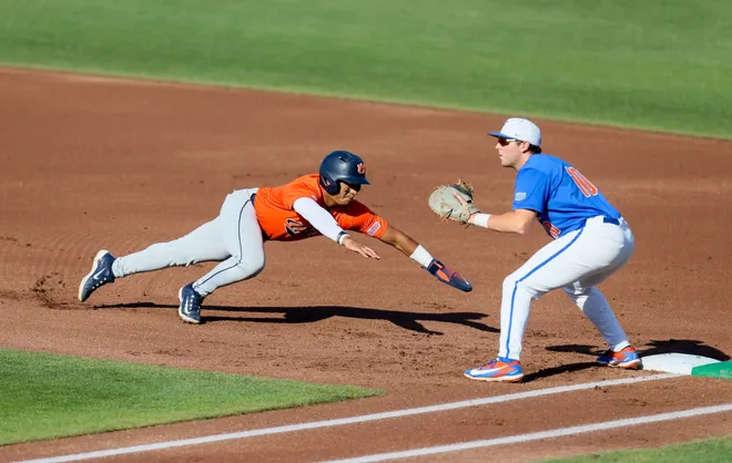 Auburn infielder Eric Guevara (8) beats throw back to first durning and NCAA baseball game at Condron Family Ballparkin Gainesville, FL on Friday, April 17, 2026. [Alan Youngblood/Gainesville Sun]
