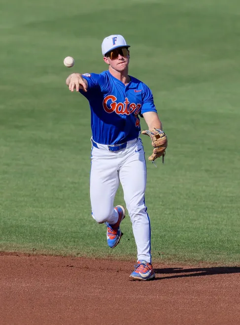 Florida infielder Cade Kurland (4) throws to first durning and NCAA baseball game at Condron Family Ballparkin Gainesville, FL on Friday, April 17, 2026. [Alan Youngblood/Gainesville Sun]