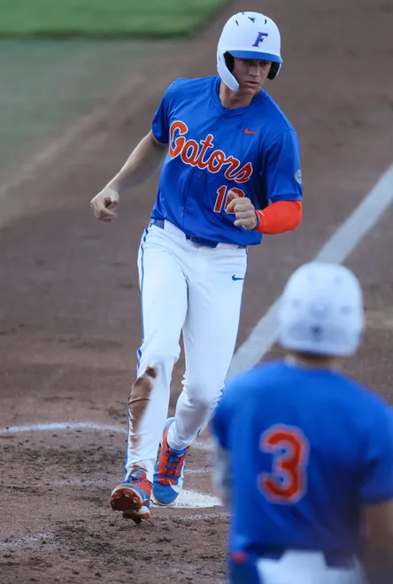 Florida infielder Ethan Surowiec (10) scores against Auburn durning and NCAA baseball game at Condron Family Ballparkin Gainesville, FL on Friday, April 17, 2026. [Alan Youngblood/Gainesville Sun]