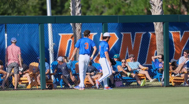 Florida outfielder Kyle Jones (3) and Blake Cyr (5) watch a home run go over the fence durning and NCAA baseball game at Condron Family Ballparkin Gainesville, FL on Friday, April 17, 2026. [Alan Youngblood/Gainesville Sun]