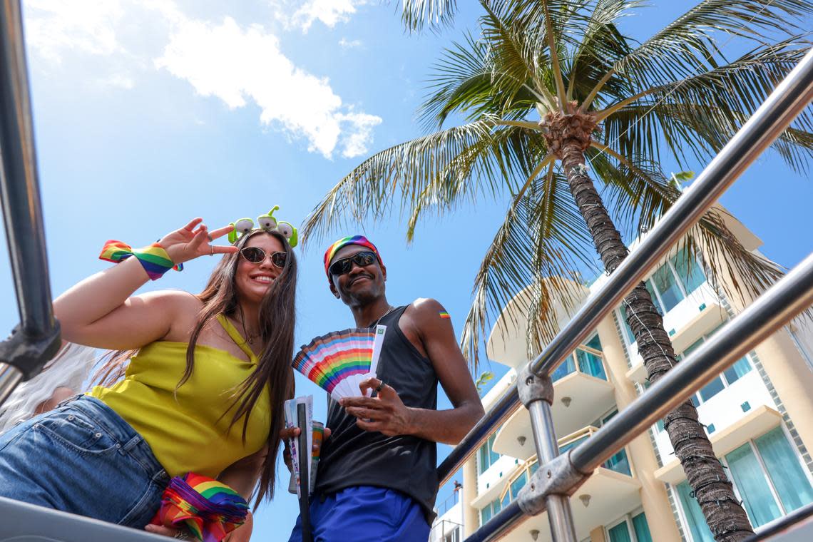 Belen Alvarado-Roman, left, and Gregory Hamilton celebrate during the 18th annual pride parade in Miami Beach, Florida, Sunday, April 12, 2026.