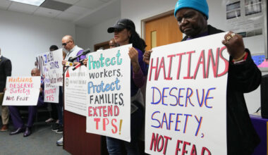 People hold signs during a rally in support of the extension of Temporary Protected Status (TPS) for Haitian immigrants before it expires on February 3, Wednesday, Jan. 28, 2026, in Fort Lauderdale, Fla. (Lynne Sladky/AP)