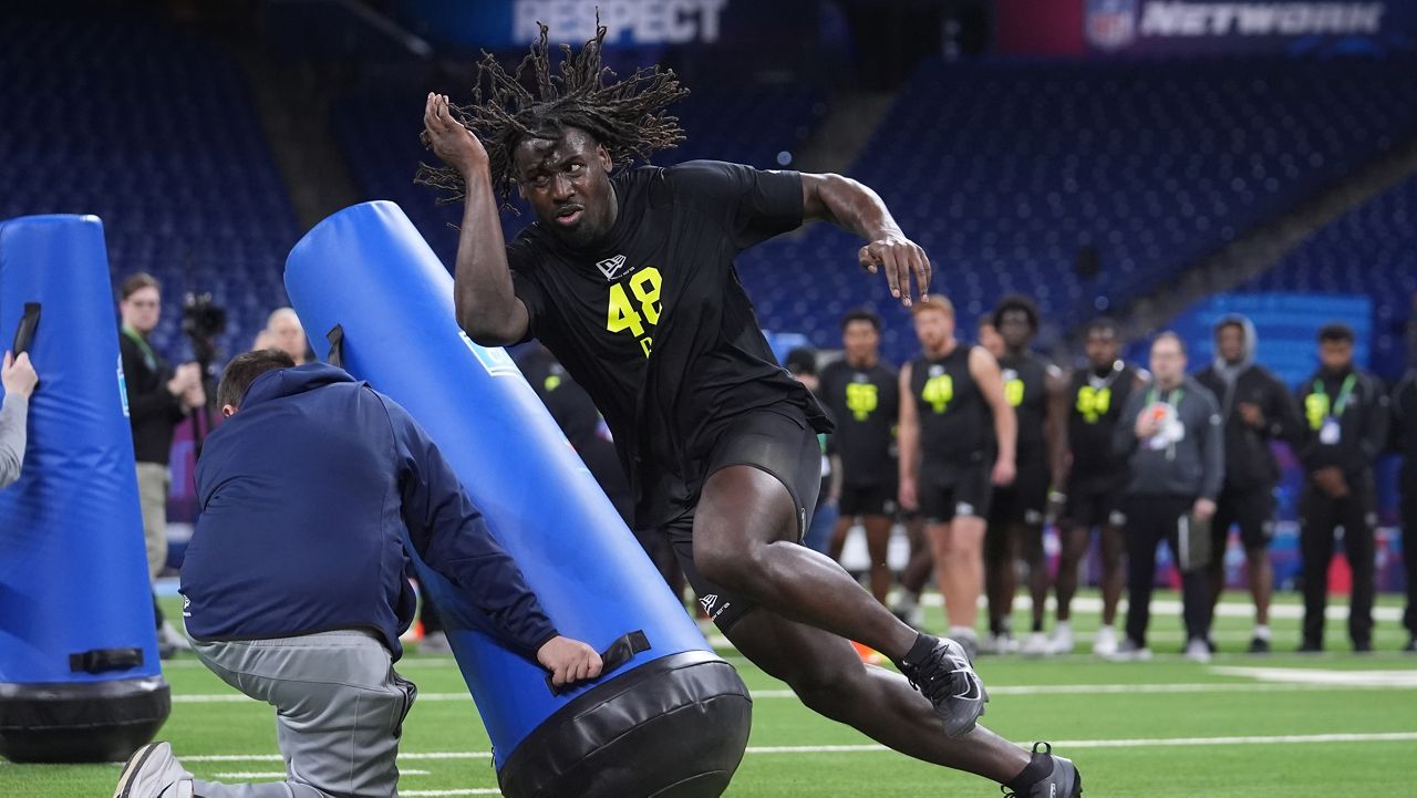 Central Florida defensive lineman Malachi Lawrence (48) runs a drill at the NFL football scouting combine in Indianapolis, Thursday, Feb. 26, 2026. (AP Photo/Michael Conroy)