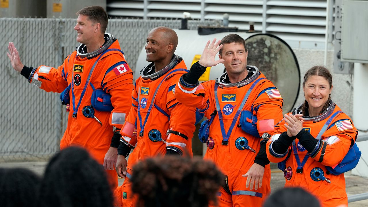 Astronauts , from left, Mission Specialist Jeremy Hansen, of Canada, Pilot Victor Glover, Commander Reid Wiseman and Mission Specialist Christina Koch leave the Operations and Checkout Building for a trip to Launch Pad 39-B and a planned liftoff on NASA's Artermis II moon rocket at the Kennedy Space Center Wednesday, April 1, 2026, in Cape Canaveral, Fla. (AP Photo/Chris O'Meara)