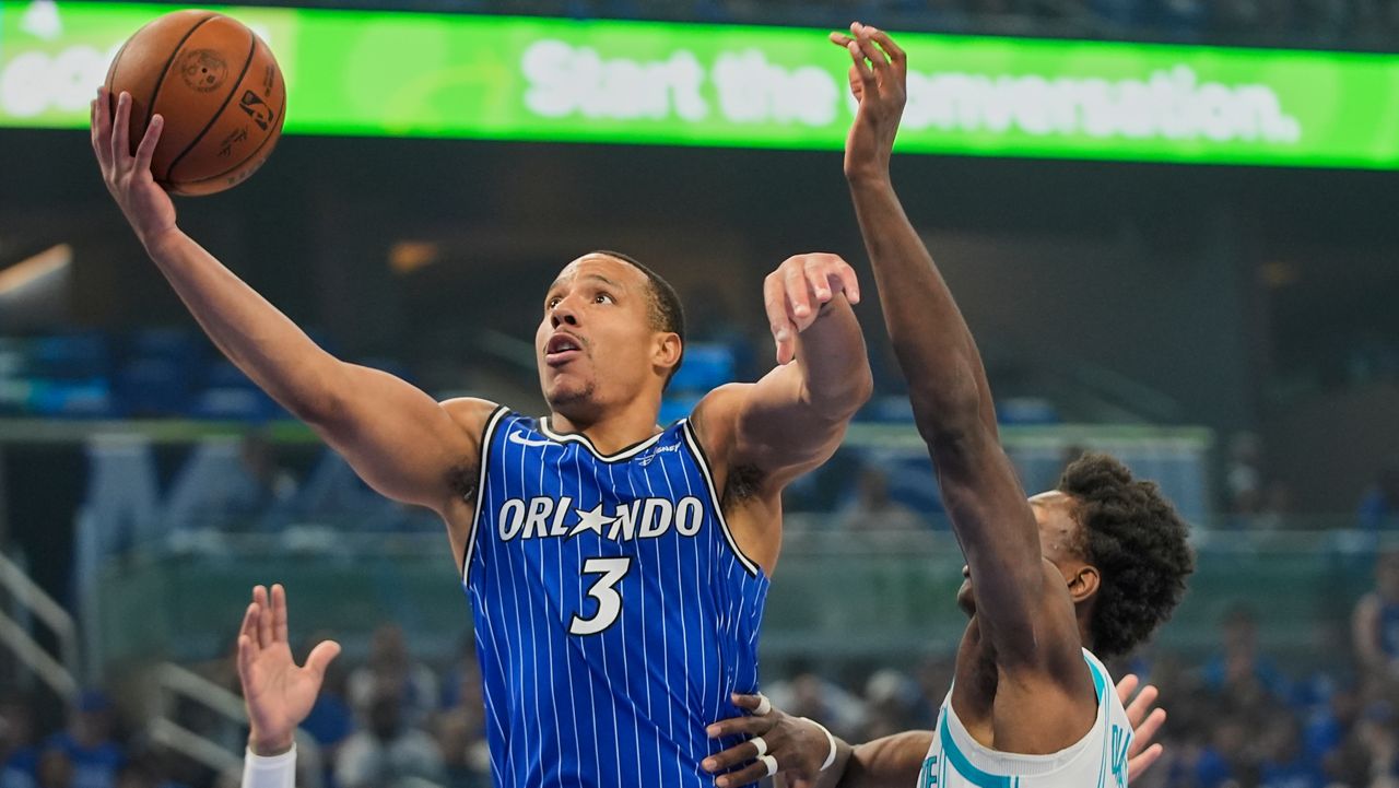 Orlando Magic guard Desmond Bane (3) shooots against Charlotte Hornets forward Moussa Diabate, right, during the first half of an NBA play-in tournament basketball game, Friday, April 17, 2026, in Orlando, Fla. (AP Photo/John Raoux)