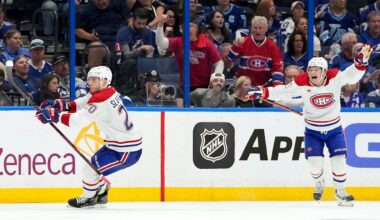 Montreal Canadiens left wing Juraj Slafkovsky (20) celebrates his goal with right wing Cole Caufield against the Tampa Bay Lightning during overtime in Game 1 of an NHL hockey Stanley Cup first-round playoff series, Sunday, April 19, 2026, in Tampa, Fla. (AP Photo/Chris O'Meara)