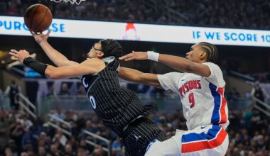 Detroit Pistons guard Ausar Thompson (9) fouls Orlando Magic guard Anthony Black (0) as he goes up for a shot during the second half in Game 3 of a first-round NBA basketball playoff series, Saturday, April 25, 2026, in Orlando, Fla. (AP Photo/John Raoux)