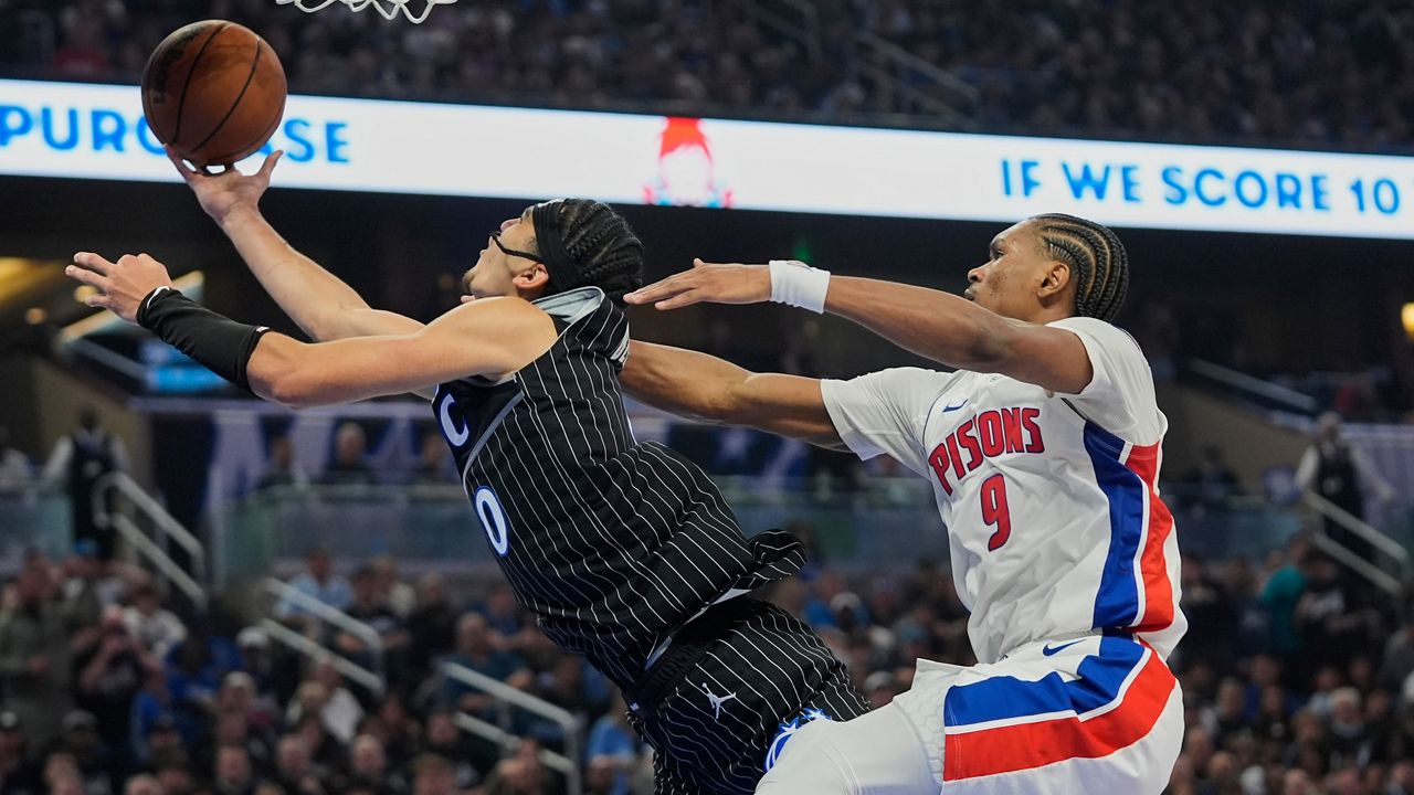 Detroit Pistons guard Ausar Thompson (9) fouls Orlando Magic guard Anthony Black (0) as he goes up for a shot during the second half in Game 3 of a first-round NBA basketball playoff series, Saturday, April 25, 2026, in Orlando, Fla. (AP Photo/John Raoux)
