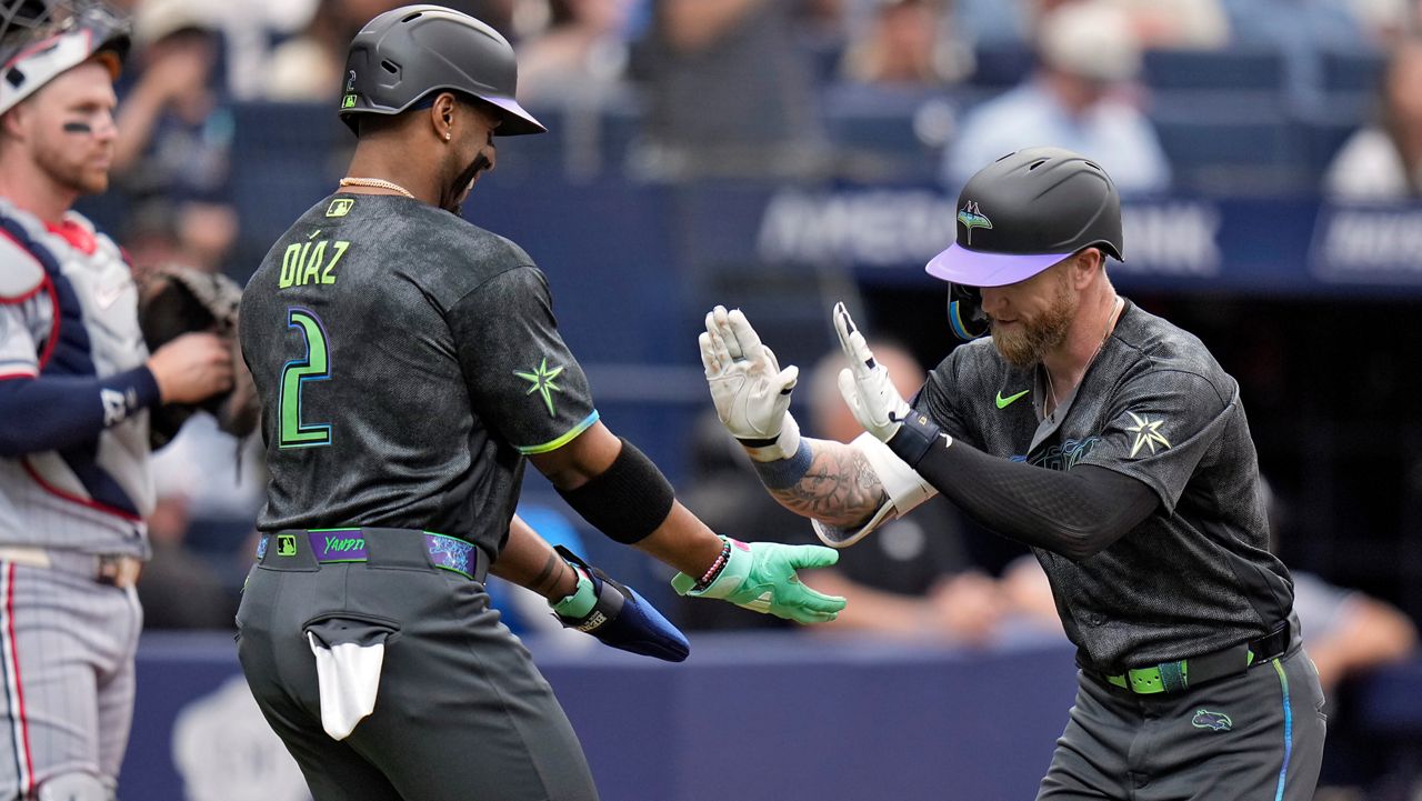 Tampa Bay Rays' Jake Fraley celebrates with Yandy DÃ­az (2) after Fraley hit a two-run home run off Minnesota Twins pitcher Bailey Ober during the fourth inning of a baseball game Saturday, April 25, 2026, in St. Petersburg, Fla. (AP Photo/Chris O'Meara)
