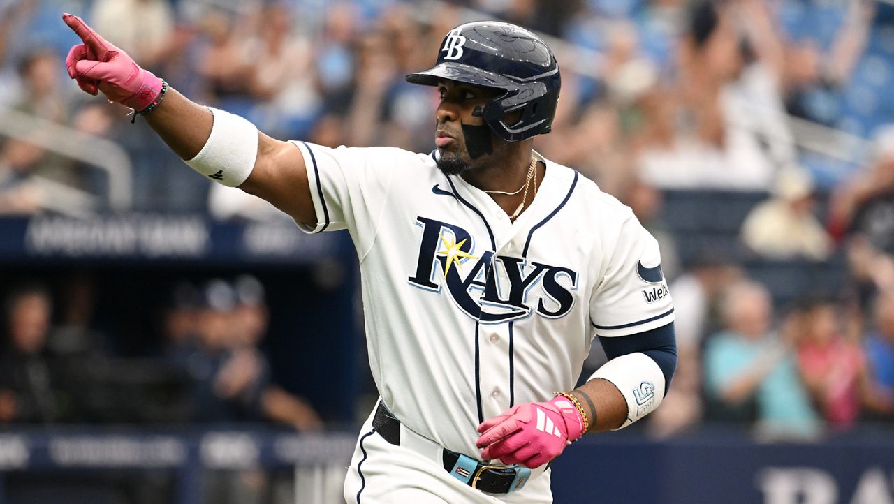 Tampa Bay Rays' Yandy Díaz celebrates as he rounds the bases after his two-run home run during the third inning of a baseball game against the Minnesota Twins Sunday, April 26, 2026, in St. Petersburg, Fla. (AP Photo/Jason Behnken)