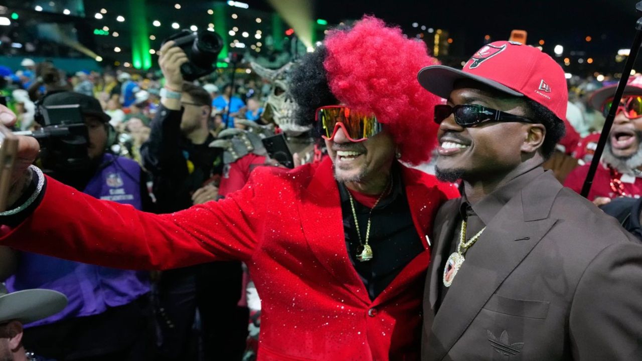 University of Miami defensive end Rueben Bain Jr. celebrates with fans after being drafted by the Tampa Bay Buccaneers with the 15th pick of the first round of the NFL Draft Thursday night. (AP Photo/Sue Ogrocki)