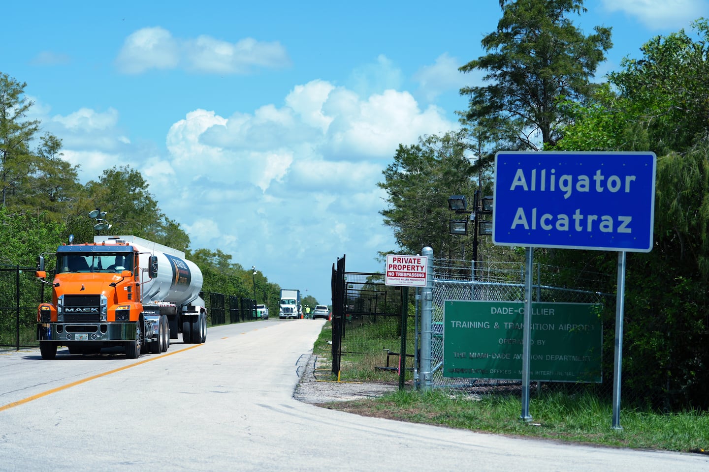 Trucks come and go from the "Alligator Alcatraz" immigration detention center in the Florida Everglades.