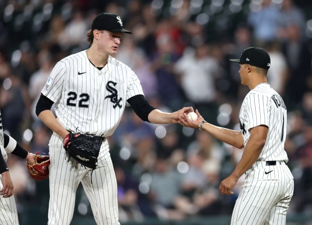 Chicago White Sox starting pitcher Noah Schultz (22) hands the ball over to manager Will Venable (1) as Schultz leaves the game in the fifth inning against the Tampa Bay Rays at Rate Field in Chicago on April 14, 2026. (Chris Sweda/Chicago Tribune)