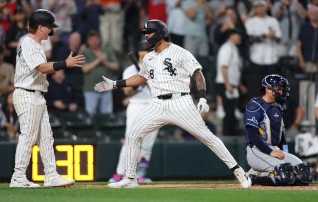 Chicago White Sox right fielder Everson Pereira is congratulated by teammate Chase Meidroth (left) after Pereira hit a 3-run home run in the third inning of a game against the Tampa Bay Rays at Rate Field in Chicago on April 14, 2026. (Chris Sweda/Chicago Tribune)
