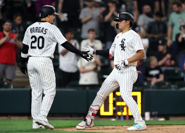 Chicago White Sox first baseman Munetaka Murakami is congratulated by teammate Miguel Vargas (20) after Murakami hit a two-run home run in the ninth inning of a game against the Tampa Bay Rays at Rate Field in Chicago on April 14, 2026. (Chris Sweda/Chicago Tribune)