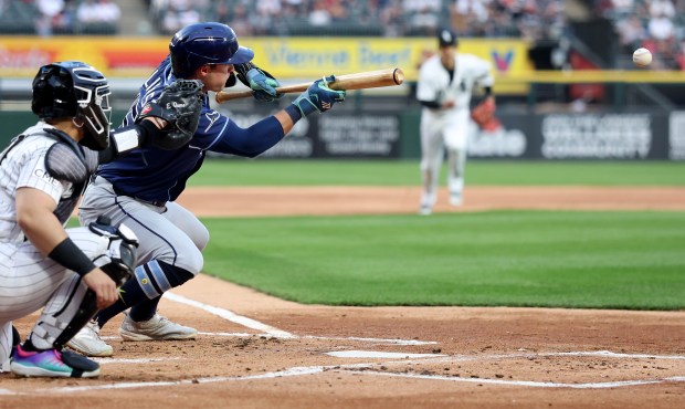 Tampa Bay Rays second baseman Ben Williamson lays down a sacrifice bunt that resulted in two Rays runs after a throwing error by Chicago White Sox starting pitcher Noah Schultz in the first inning of a game at Rate Field in Chicago on April 14, 2026. (Chris Sweda/Chicago Tribune)