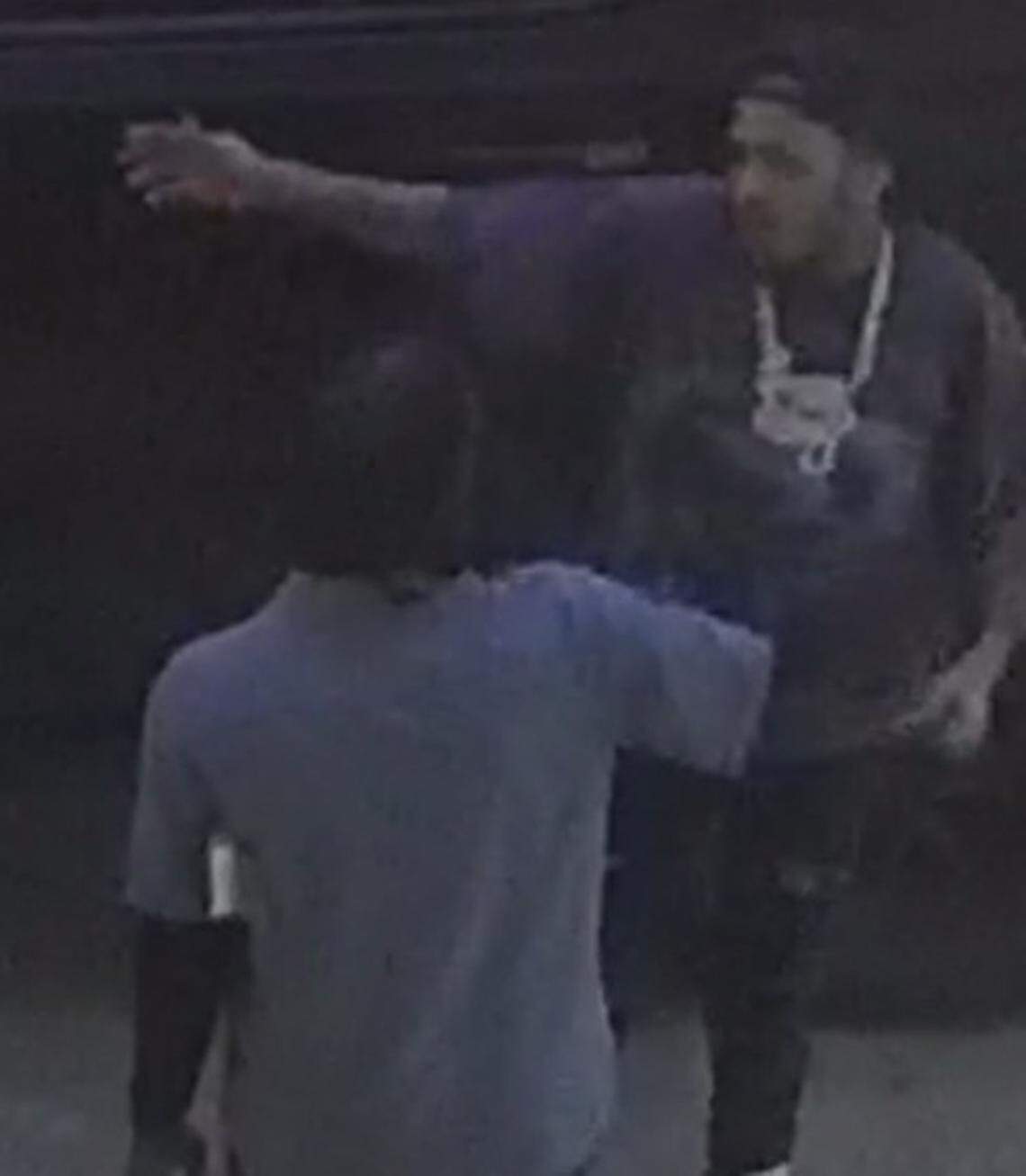 A man wearing a large chain is seen talking with another man outside the Seminole Hard Rock Hotel & Casino on Monday, April 6, 2026. The rapper Offset was shot that night.