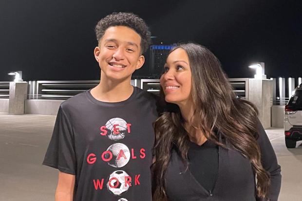 In this undated photo provided by Megan Garcia in October 2024, she stands with her son, Sewell Setzer III. Garcia appeared with Gov. Ron DeSantis in Jupiter on Monday, Dec. 15, 2025, to describe her son's interaction with artificial intelligence, which she said led to his suicide. (Courtesy Megan Garcia via AP, File)