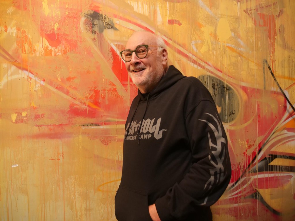 Portrait of a man wearing a hoodie that reads Rock n Roll
