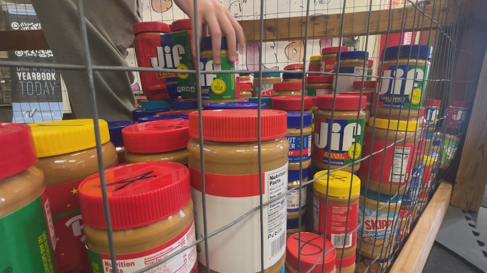 Jars of PB&J are collected at Leon High School for the 10th annual PBJ PLZ! donation drive.
