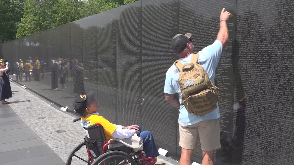 Vietnam Veteran Paul Corley looks for the names of fellow Rickards High graduates who lost...