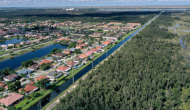 An aerial view of urban sprawl nestled next to protected wetlands on the fringes of Everglades National Park in Miami Dade County, Florida. Credit: Joe Raedle/Getty Images