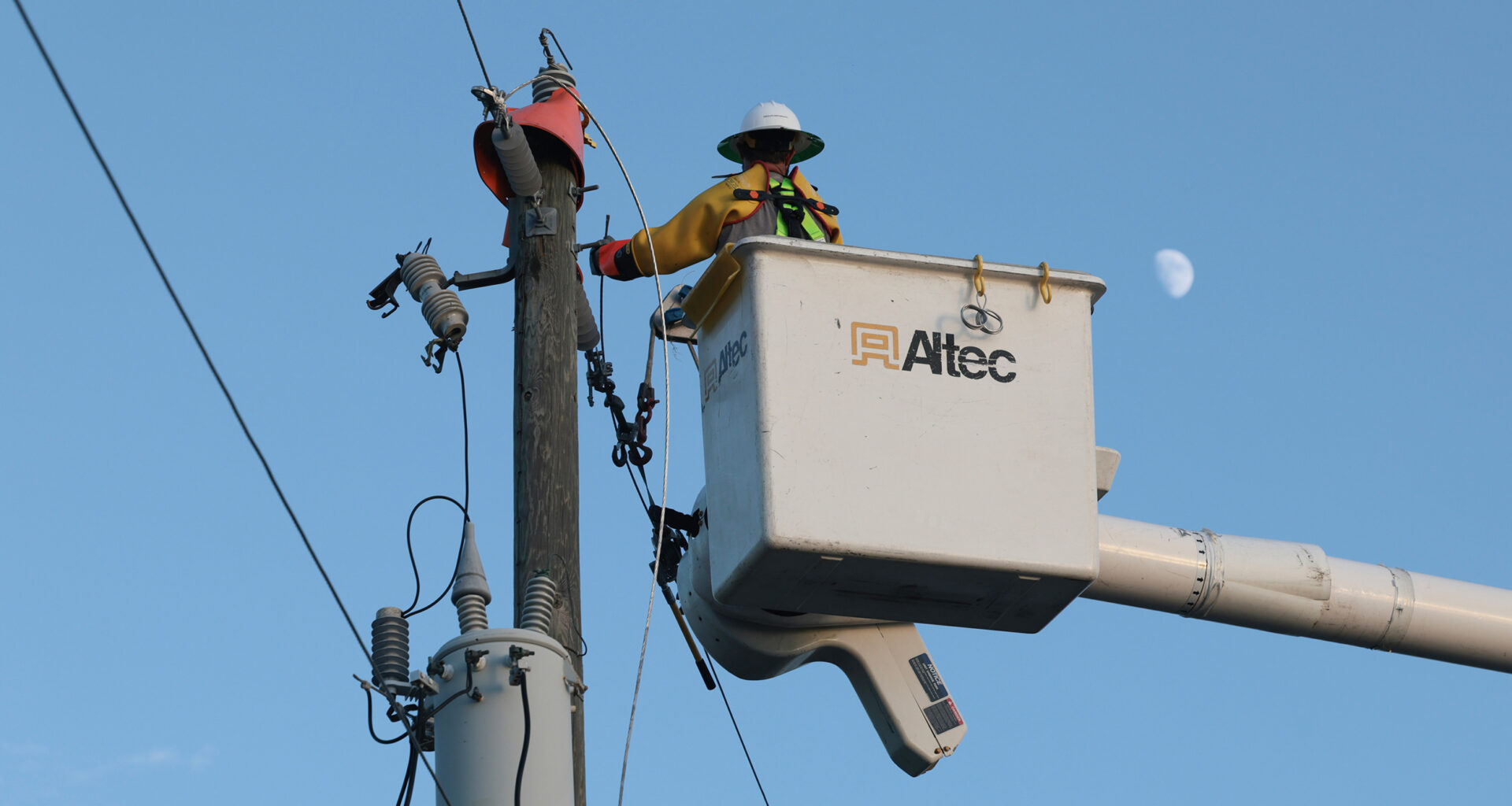 A utility worker with Florida Power & Light services a transformer in Punta Gorda, Fla., on Oct. 12, 2024. Credit: Thomas O'Neill/NurPhoto via Getty Images