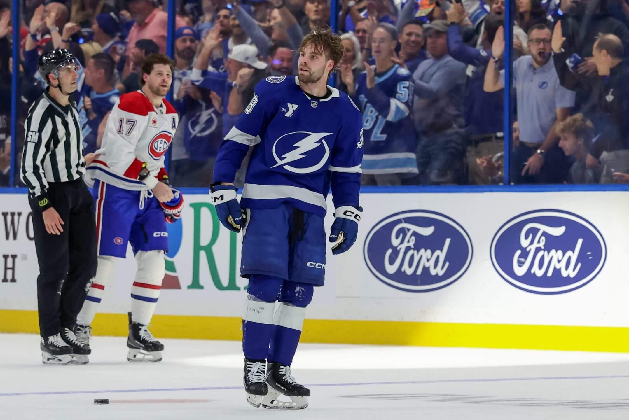 Tampa Bay's Brandon Hagel looks to the crowd after a fight versus Montreal.