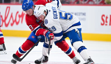 MONTREAL, CANADA - APRIL 24: Cole Caufield #13 of the Montréal Canadiens and Jake Guentzel #59 of the Tampa Bay Lightning battle for the puck in the second period of Game Three of the First Round of the 2026 Stanley Cup Playoffs at the Bell Centre on April 24, 2026 in Montreal, Quebec, Canada. (Photo by Minas Panagiotakis/Getty Images)
