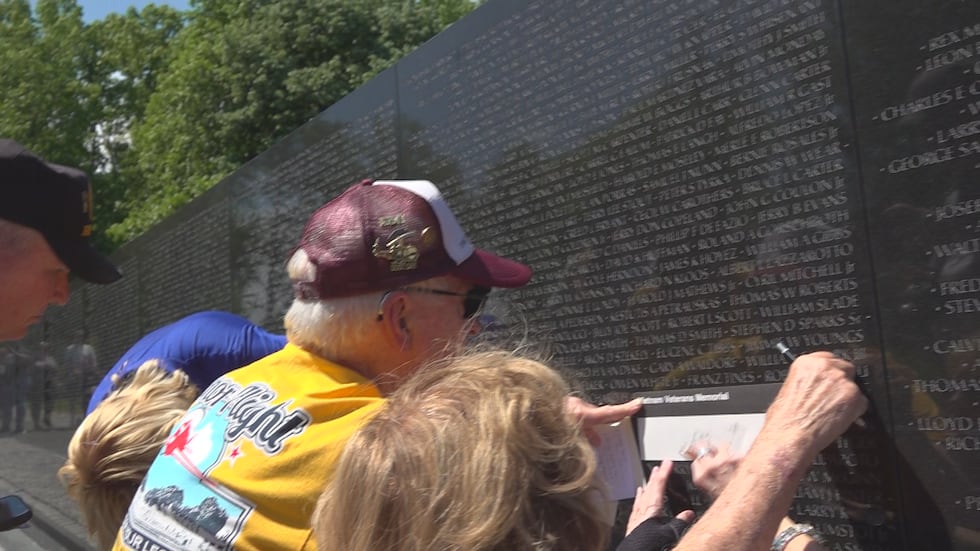 Donalsonville resident Mark Carr etches the name of a hometown hero who perished in Vietnam.