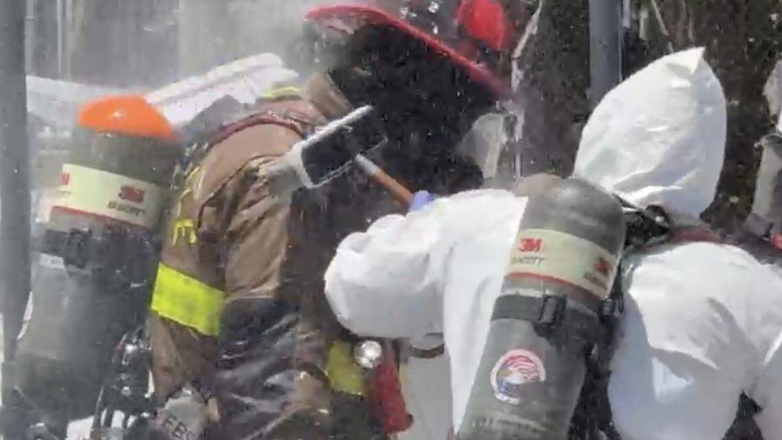A Fort Lauderdale Fire Rescue member is scrubbed down with a brush and water after being exposed to anhydrous ammonia at a Port Everglades cold-storage facility Tuesday morning, April 28, 2026. A Fort Lauderdale Fire Rescue member is scrubbed down with a brush and water after being exposed to anhydrous ammonia at a Port Everglades cold-storage facility Tuesday morning, April 28, 2026.
