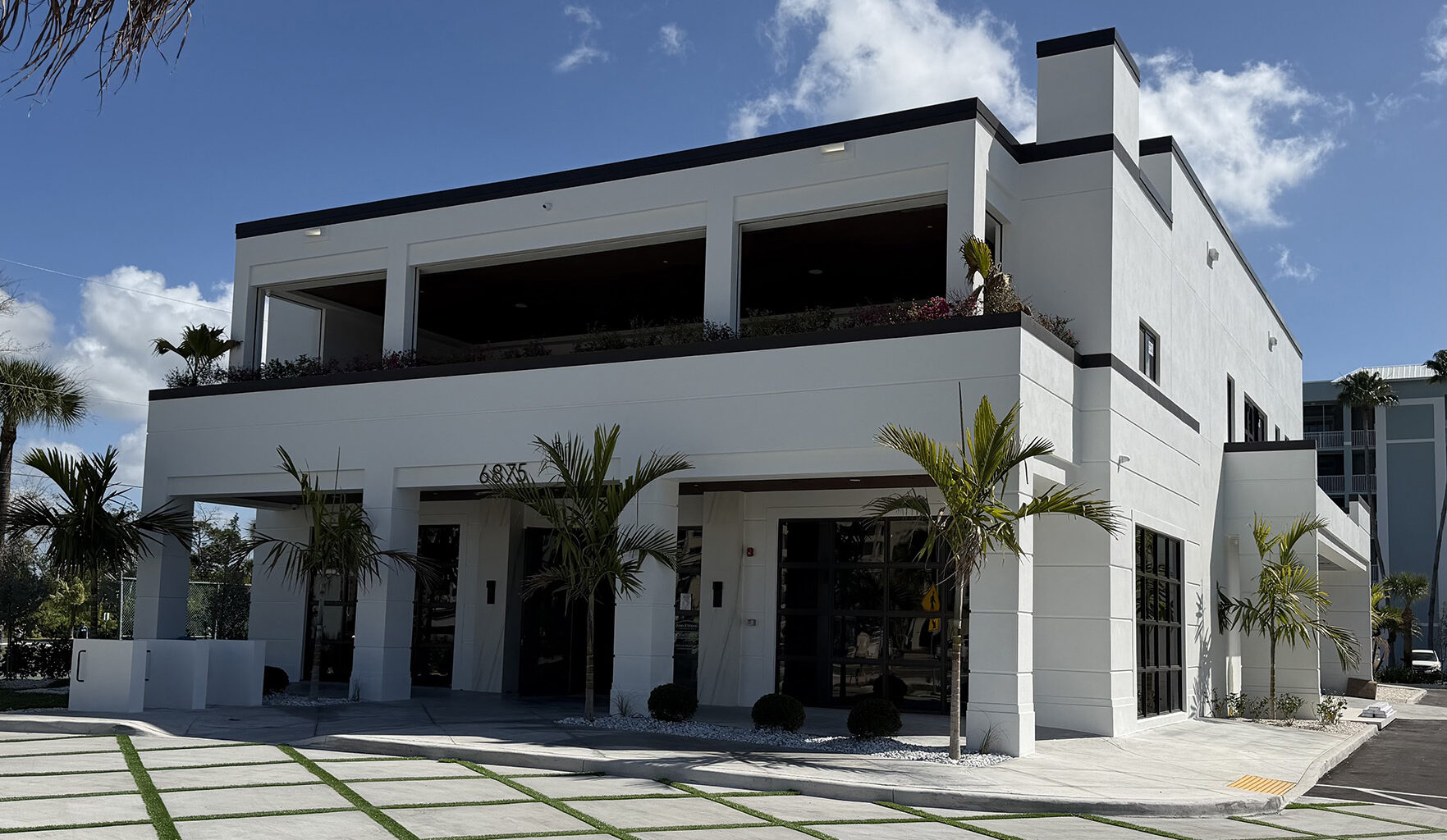 John R. Wood Christie’s International, Interiors Unlimited open collaborative office on Fort Myers Beach 