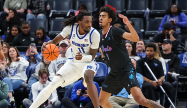 Jan 29, 2026; Memphis, Tennessee, USA; Memphis Tigers forward Aaron Bradshaw (11) drives against Florida Atlantic Owls forward Devin Williams (1) during the second half at FedExForum. Mandatory Credit: Wesley Hale-Imagn Images