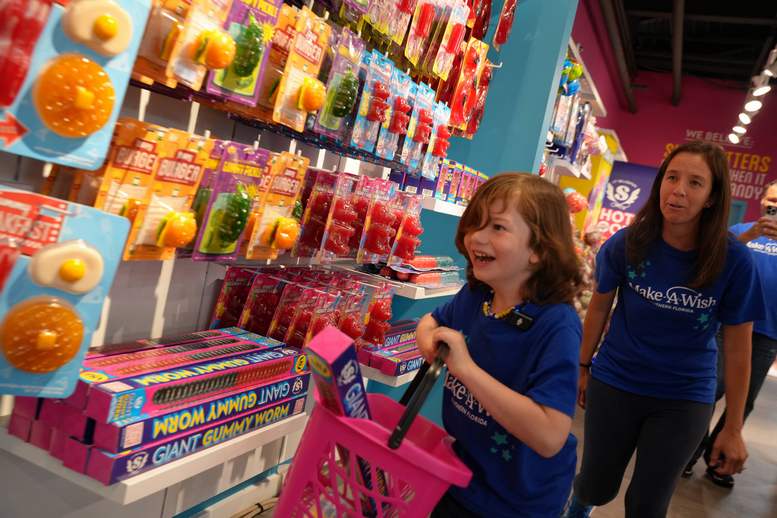 Make A Wish visits IT’SUGAR at Downtown’s Bayside Marketplace