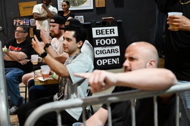 Fans sip craft beer and eat pub grub while watching Bash at the Brew at The Tank Brewing Co. in Doral. The monthly show is produced by Coastal Championship Wrestling and regularly draws between 300 and 500 people to the taproom. (Michele Eve Sandberg/Contributor)
