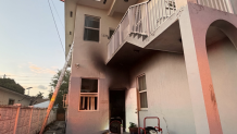 A photo provided by Miami Fire Rescue shows the outside of the structure that caught fire in Liberty City on March 31, 2026.