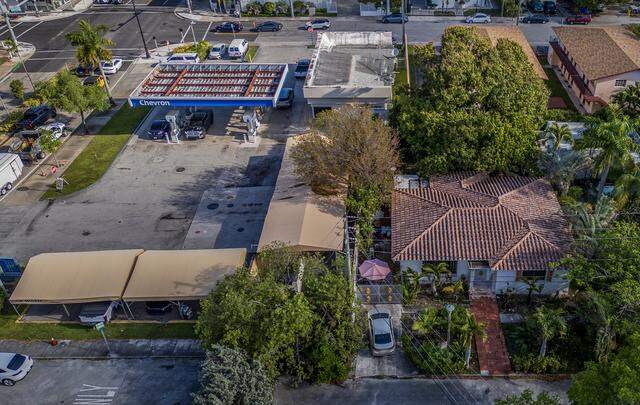View of a residential house (far right) located next to a Chevron gas station (far left) both properties located in the Morningside neighborhood in Miami, on Tuesday, March 31, 2026.