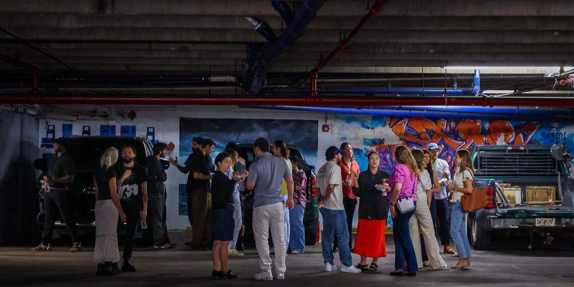 Alex Gartenfeld, ICA Miami artistic director, center/right, speaks with artists as museum cohorts gather for a tour of the Tunnel Projects, an art space dedicated to supporting local artists, on Saturday, April 11, 2026, in Little Havana, Miami.