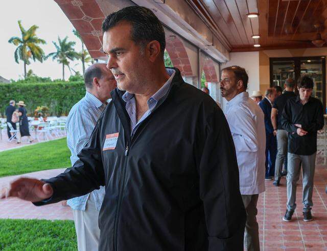 Cigar makers Christian Louis Eiroa, center, mingles with other Cuban and Cuban-American entrepreneurs as they gathered for a private event on Tuesday, March 31, 2026, in Miami, Florida, to organize and pledge to invest in Cuba if there is a change in government.