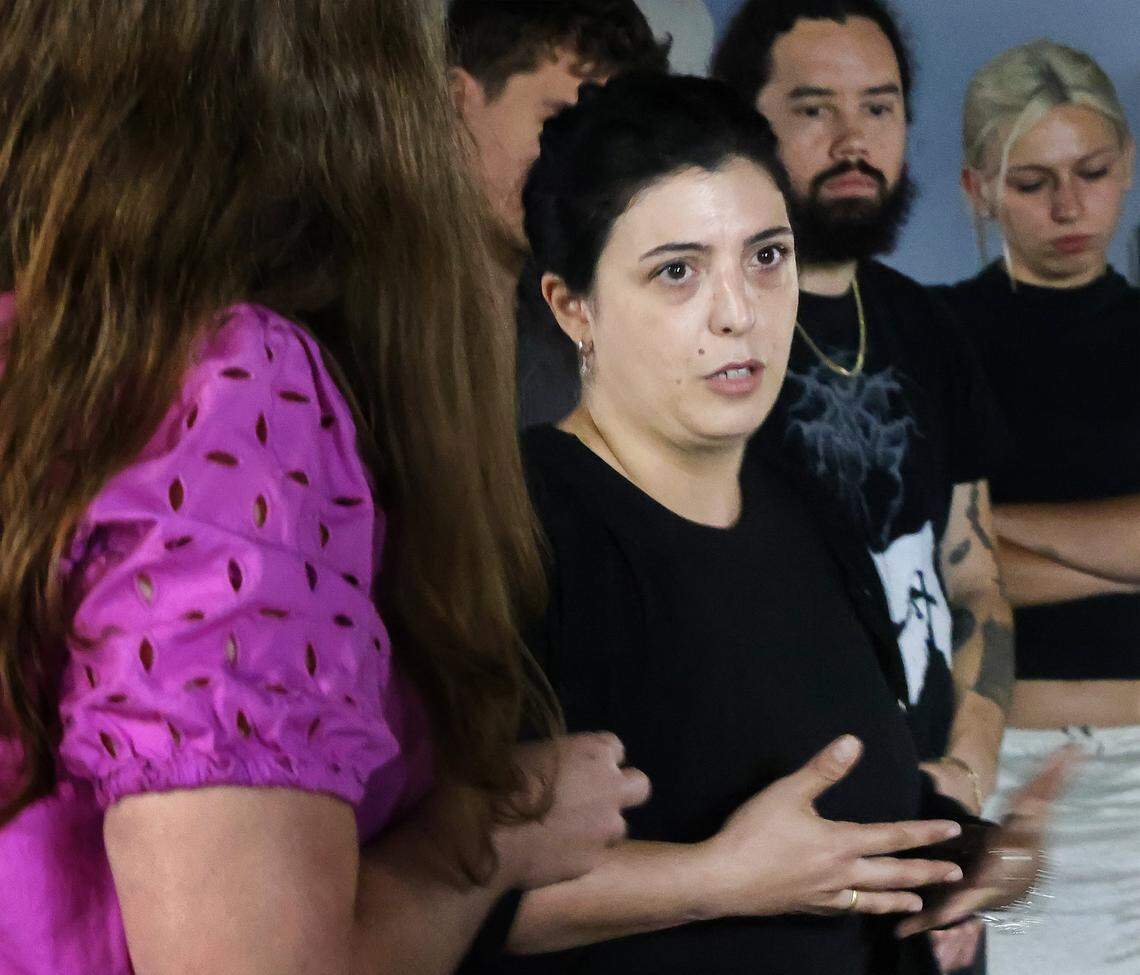 Luna Palazzolo-Daboul, center, speaks among artists and ICA museum cohorts during a tou of the Tunnel Projects, an art space dedicated to supporting local artists, on Saturday, April 11, 2026, in Little Havana, Miami.